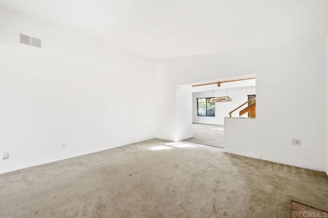 unfurnished living room featuring carpet