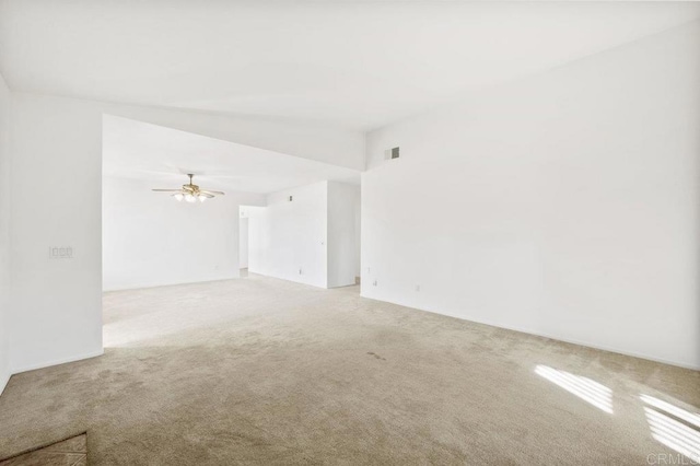 carpeted empty room with ceiling fan