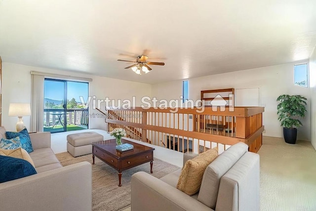 living room featuring ceiling fan and light colored carpet