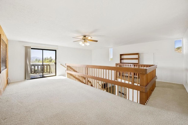 empty room with carpet and ceiling fan