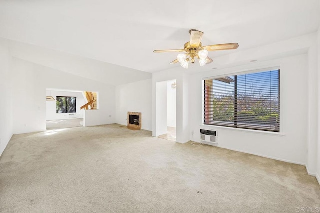 unfurnished living room with light carpet, heating unit, vaulted ceiling, and ceiling fan