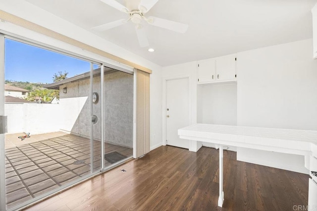 interior space with ceiling fan and hardwood / wood-style floors