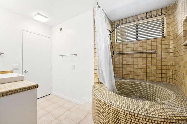 bathroom featuring a shower with shower curtain, vanity, and tile patterned floors