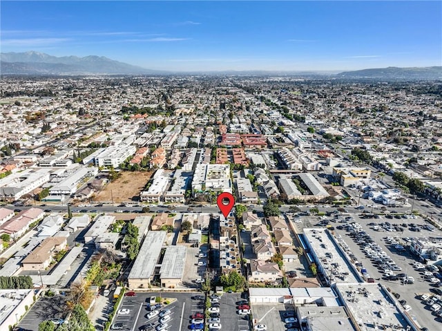 birds eye view of property with a mountain view