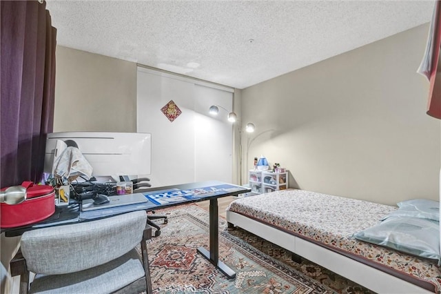 bedroom featuring a textured ceiling