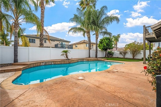 view of swimming pool with a patio area