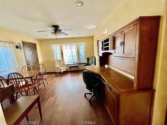 office featuring dark wood-type flooring and ceiling fan