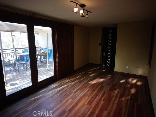 empty room with dark wood-type flooring