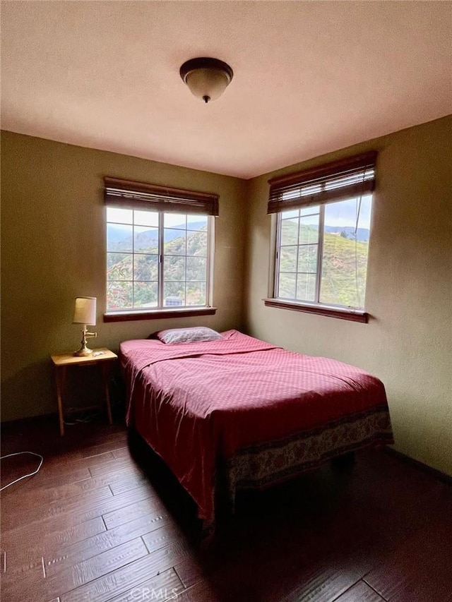 bedroom featuring dark hardwood / wood-style floors