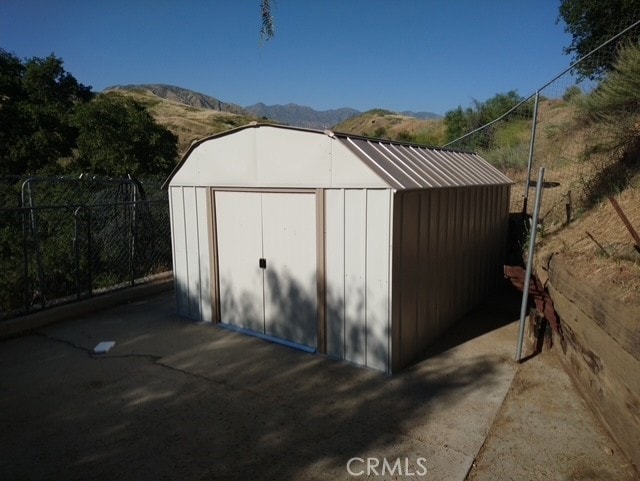 view of outdoor structure featuring a mountain view