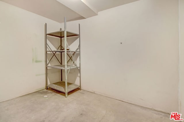 unfurnished dining area featuring concrete floors