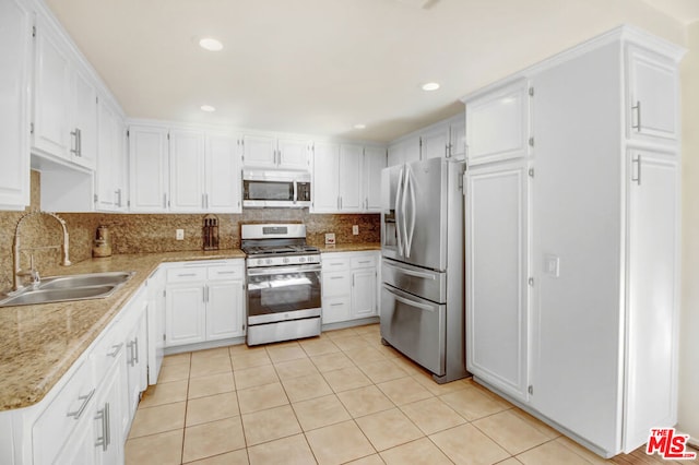 kitchen with white cabinetry, sink, and appliances with stainless steel finishes