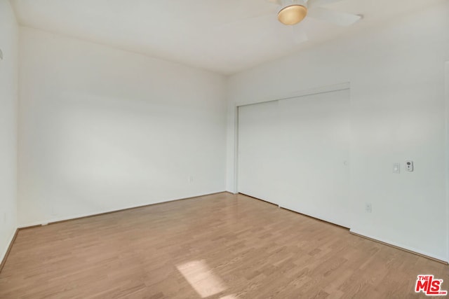 spare room with ceiling fan and light hardwood / wood-style floors