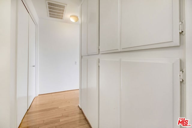 corridor featuring light hardwood / wood-style flooring