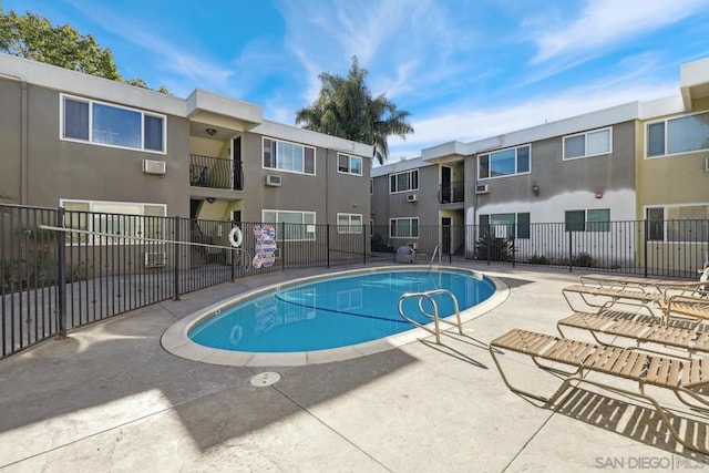 view of swimming pool with a patio area