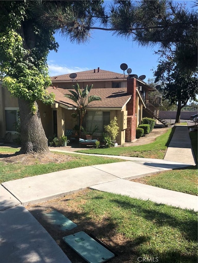 exterior space featuring a front yard