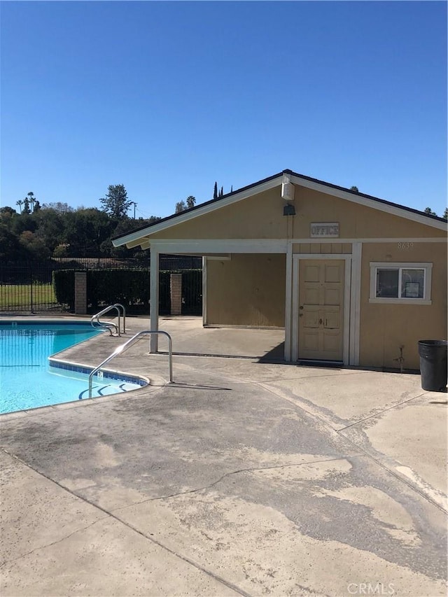 view of swimming pool with a patio area