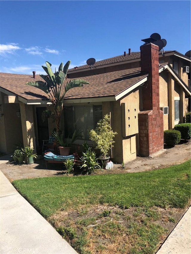 view of property exterior featuring a lawn