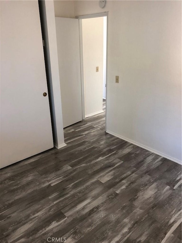 empty room featuring dark hardwood / wood-style floors