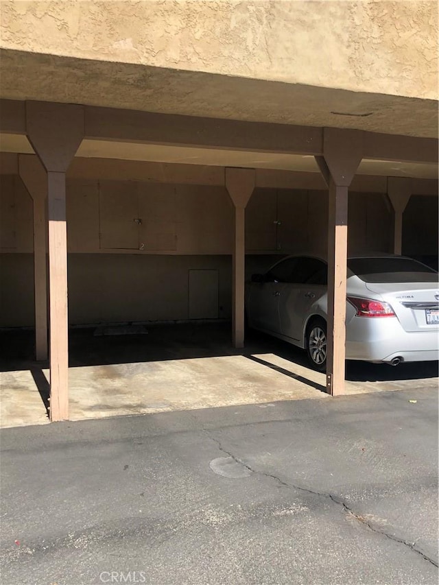 view of parking featuring a carport