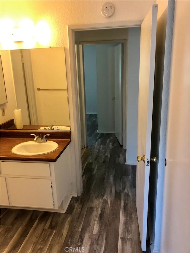 bathroom with vanity and hardwood / wood-style flooring