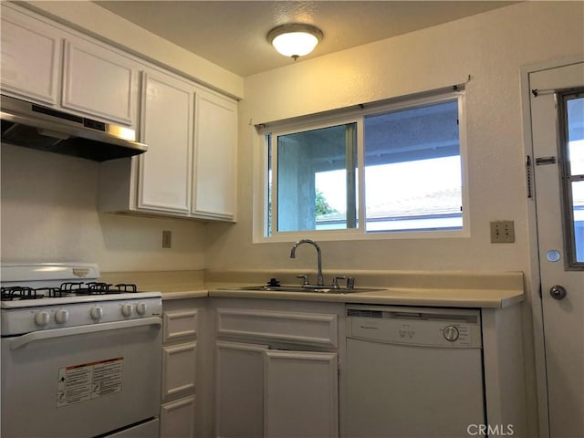 kitchen featuring white cabinets, white appliances, and sink