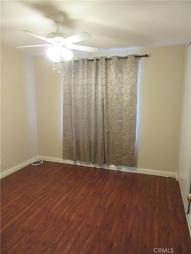 empty room with ceiling fan and hardwood / wood-style floors