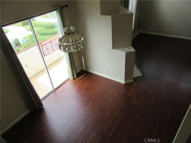 empty room featuring dark wood-type flooring