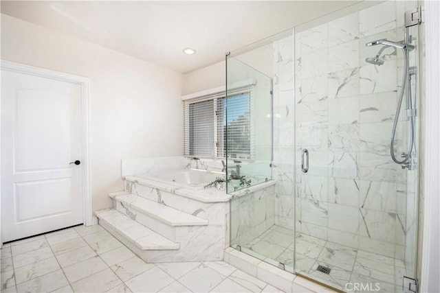 bathroom featuring separate shower and tub