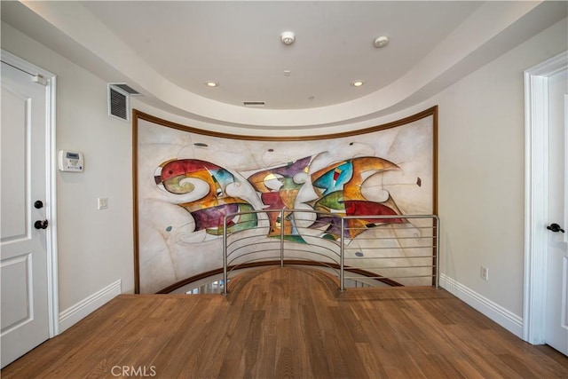 unfurnished dining area with wood-type flooring