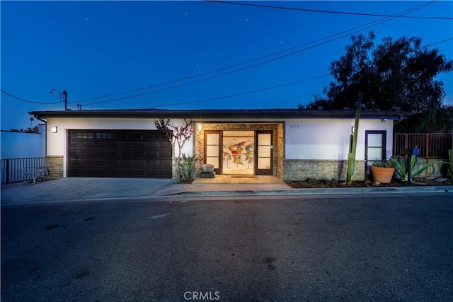 ranch-style home with a garage