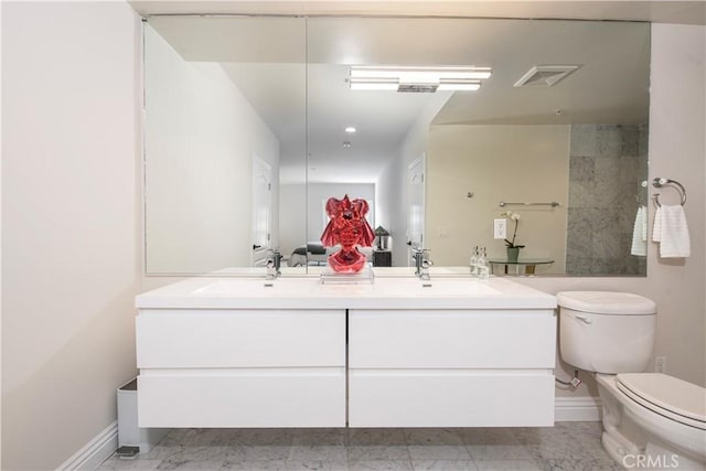 bathroom with vanity and toilet