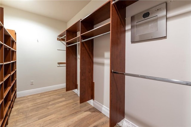 walk in closet featuring light hardwood / wood-style floors