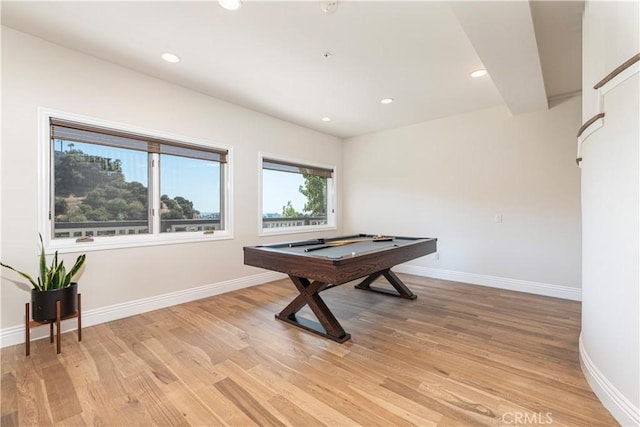 playroom featuring beam ceiling, billiards, and light hardwood / wood-style flooring