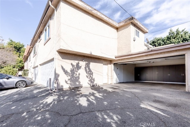 view of side of home with a garage