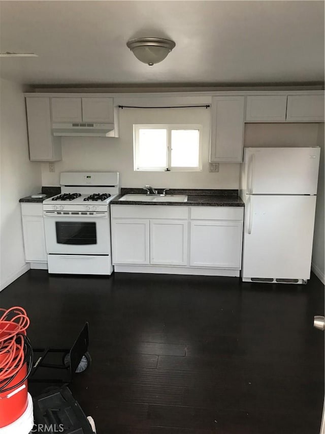 kitchen with dark wood-type flooring, sink, white cabinets, and white appliances