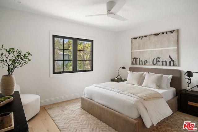 bedroom featuring ceiling fan and light hardwood / wood-style floors