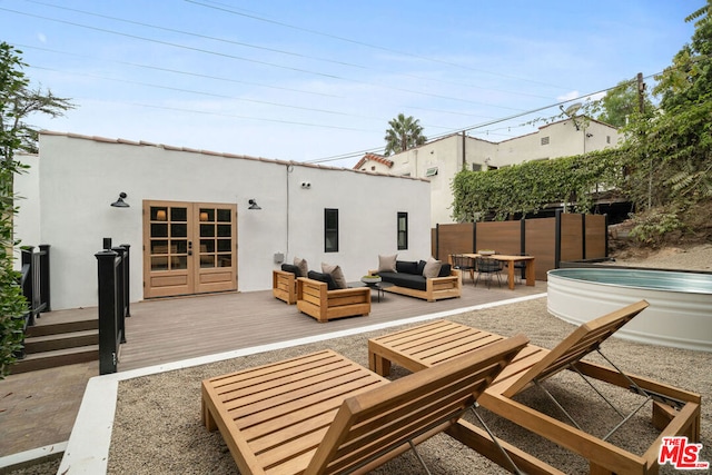 rear view of property featuring an outdoor hangout area and a deck