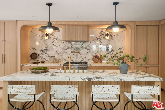 kitchen with backsplash, a center island, and hanging light fixtures