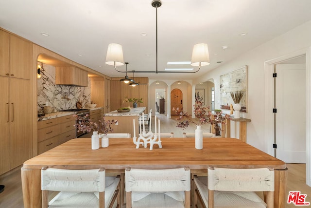 dining space with light hardwood / wood-style floors