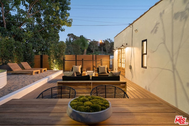 deck featuring outdoor lounge area