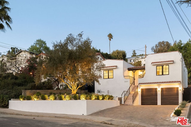 mediterranean / spanish-style home featuring a garage