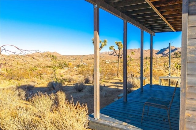 wooden terrace featuring a mountain view