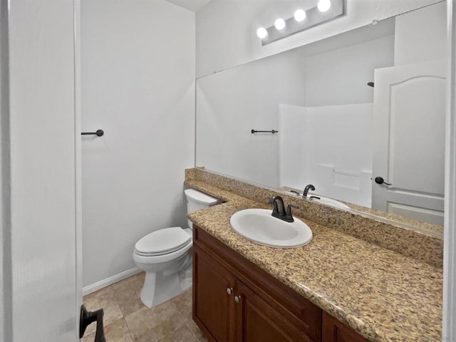 bathroom with toilet, vanity, a shower, and tile patterned floors