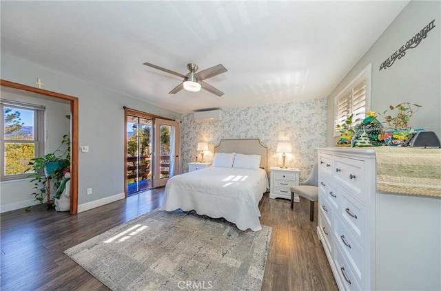 bedroom with ceiling fan, access to exterior, multiple windows, and dark hardwood / wood-style floors