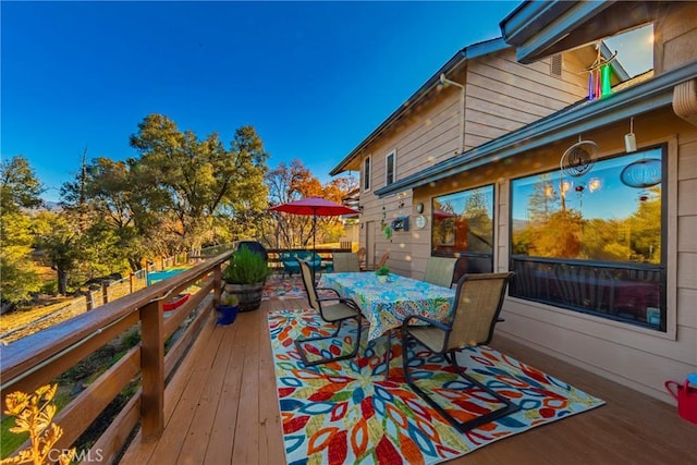 deck featuring outdoor dining space