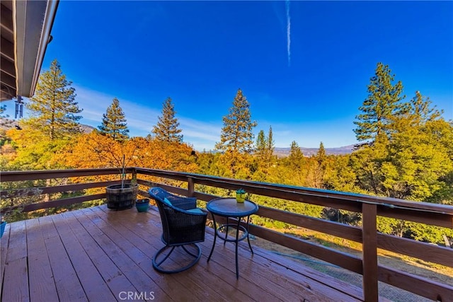 deck featuring a wooded view