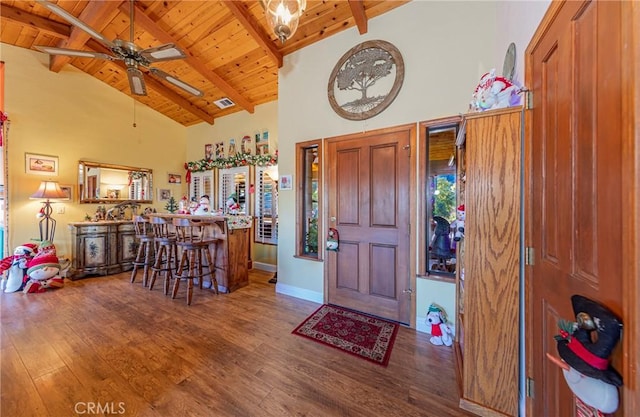 entrance foyer with wood ceiling, wood-type flooring, beamed ceiling, high vaulted ceiling, and ceiling fan