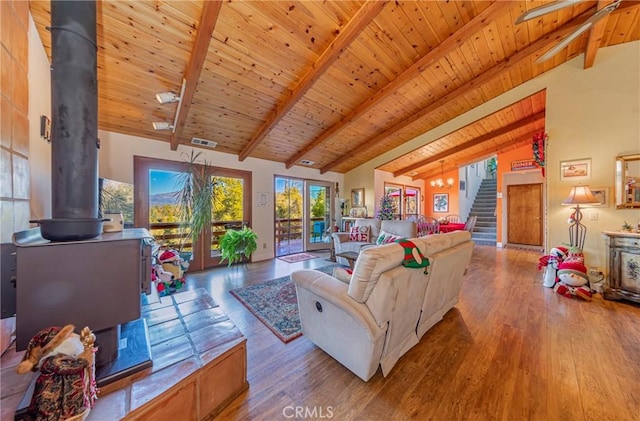 living room featuring wood-type flooring, beamed ceiling, french doors, high vaulted ceiling, and wooden ceiling