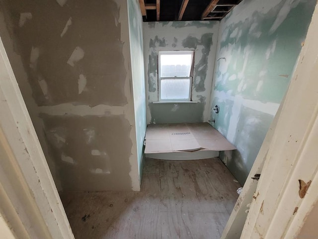 bathroom with hardwood / wood-style flooring